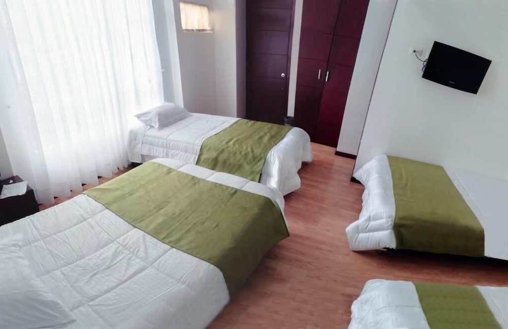 غرفة عائلية بسرير كوين وسريرين كوين، Nogal Suite Hotel Pasto 9/10