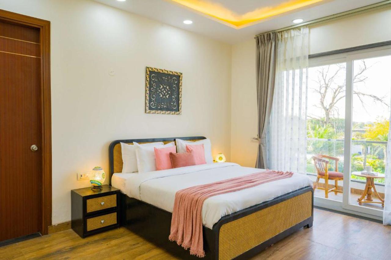 Room at ELIVAAS AdhiVa Retreat 5 BHK Farmhouse with Pvt Pool, Bar & Lush Garden, GURGAON