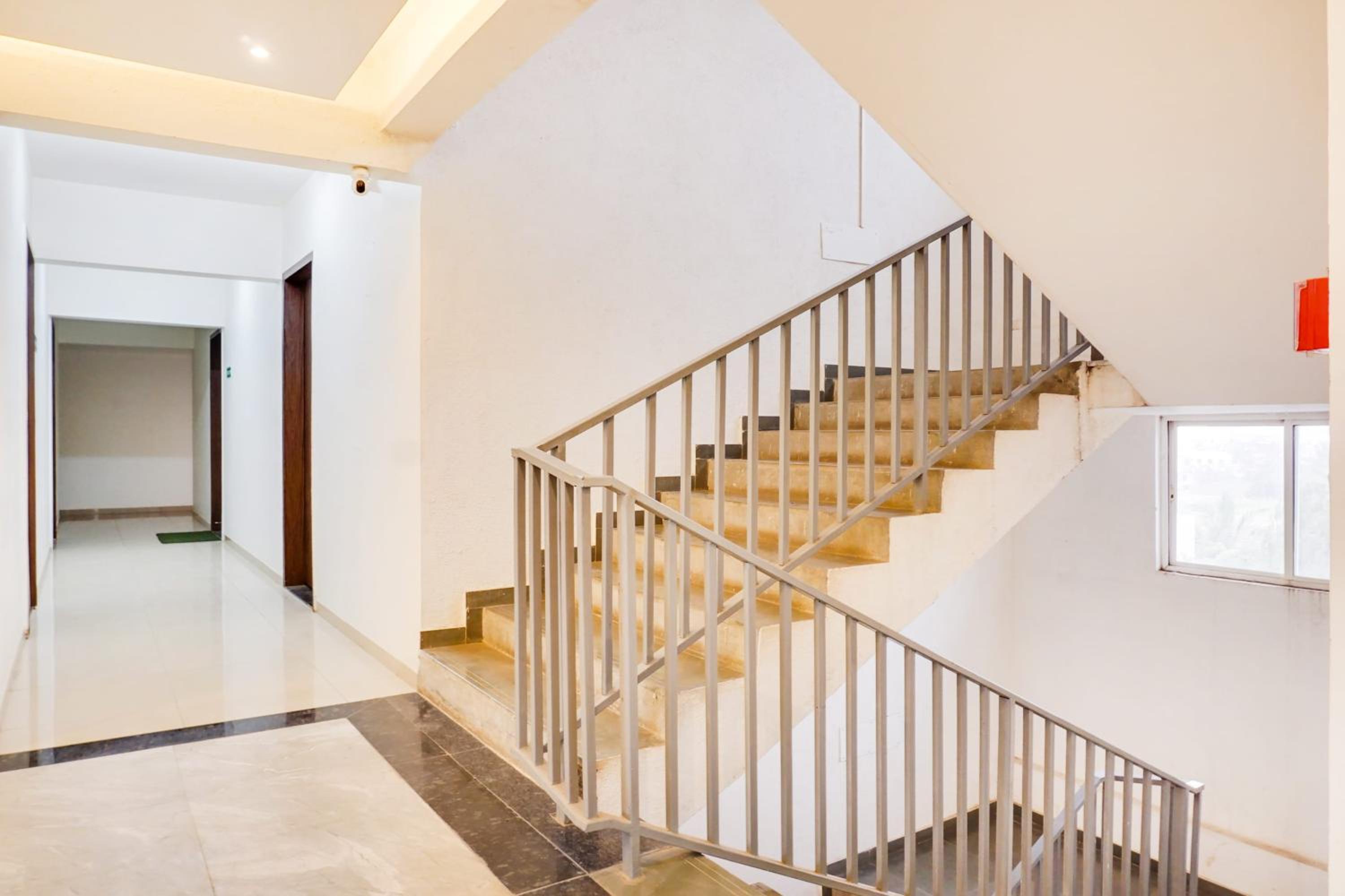 Super Townhouse Lohegaon Near Pune Airport formerly Landmark Regency 22/29