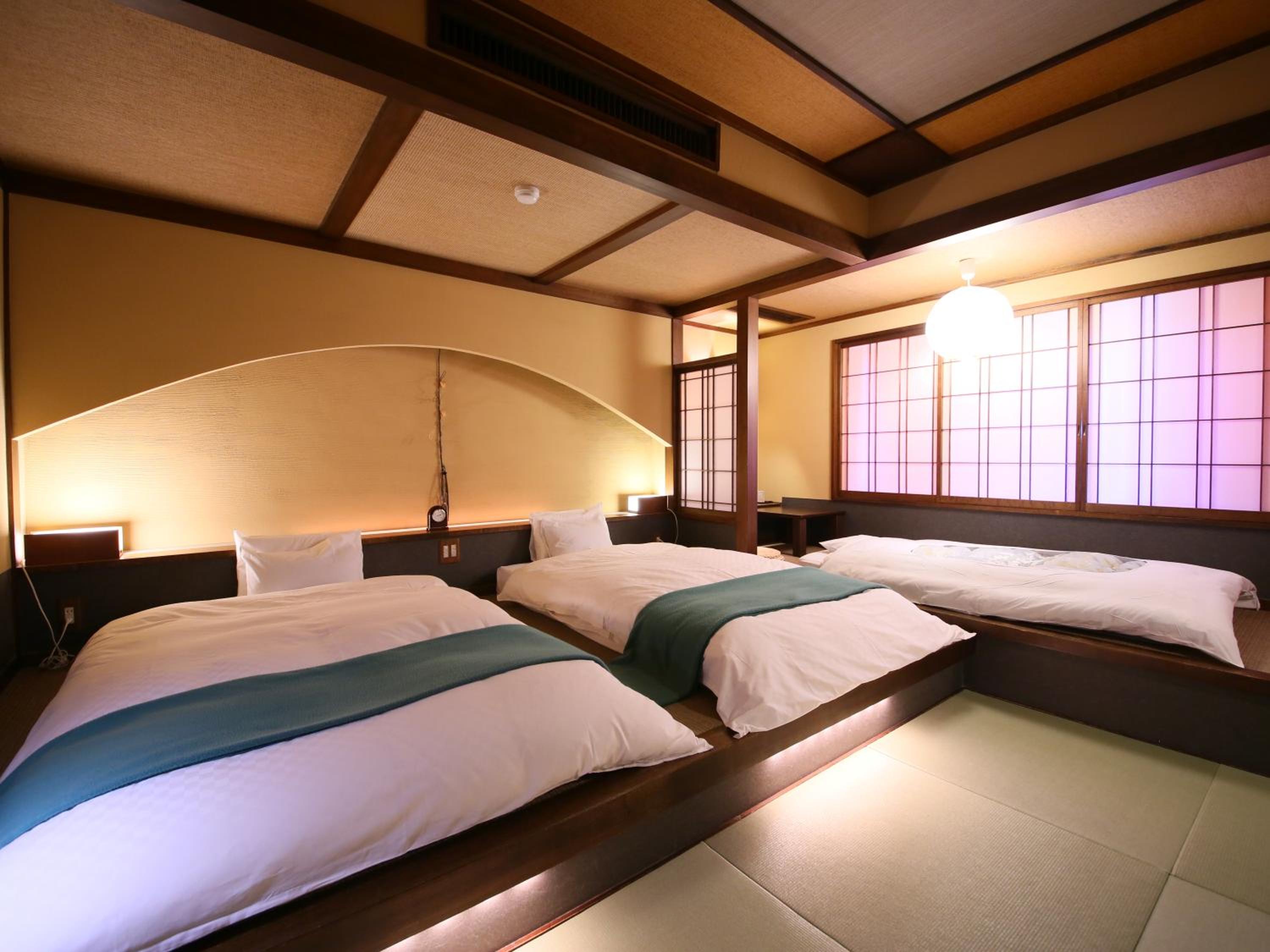 غرفة بسريرين منفصلين بأرضية تاتامي، Hotel Tamanoyu 2/10